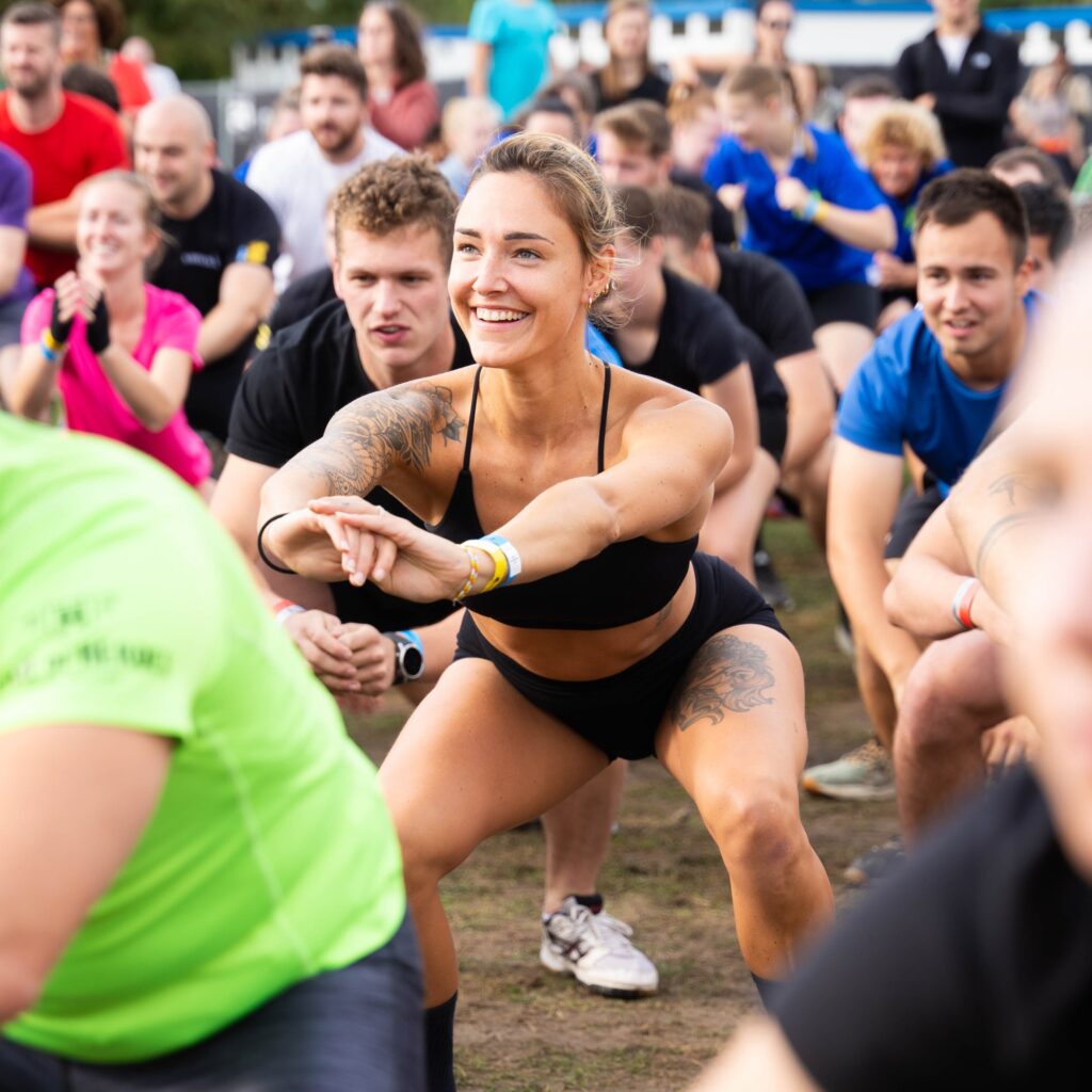 Woman doing squats: a form of functional training